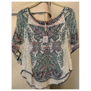 Knit print with pink embroidered pancho style top
